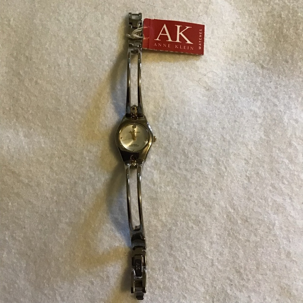Ann Klein ladies watch, Diamond and water resist. Needs battery.
